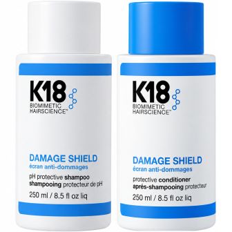 K18 Damage Shield Shampoo & Conditioner pakshot met witte flessen en blauwe doppen