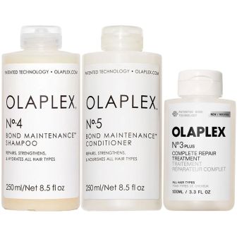 Olaplex voordeelset met drie flacons shampoo, conditioner en treatment naast elkaar