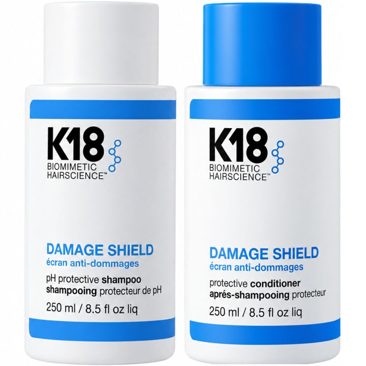 K18 Damage Shield Shampoo & Conditioner pakshot met witte flessen en blauwe doppen